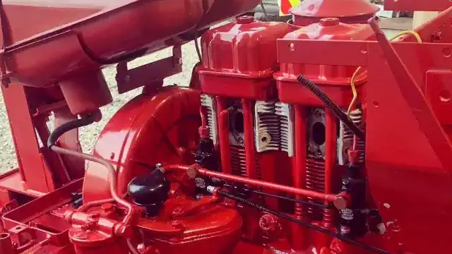 Industrial Paint Spraying. Finished Red Tractor.