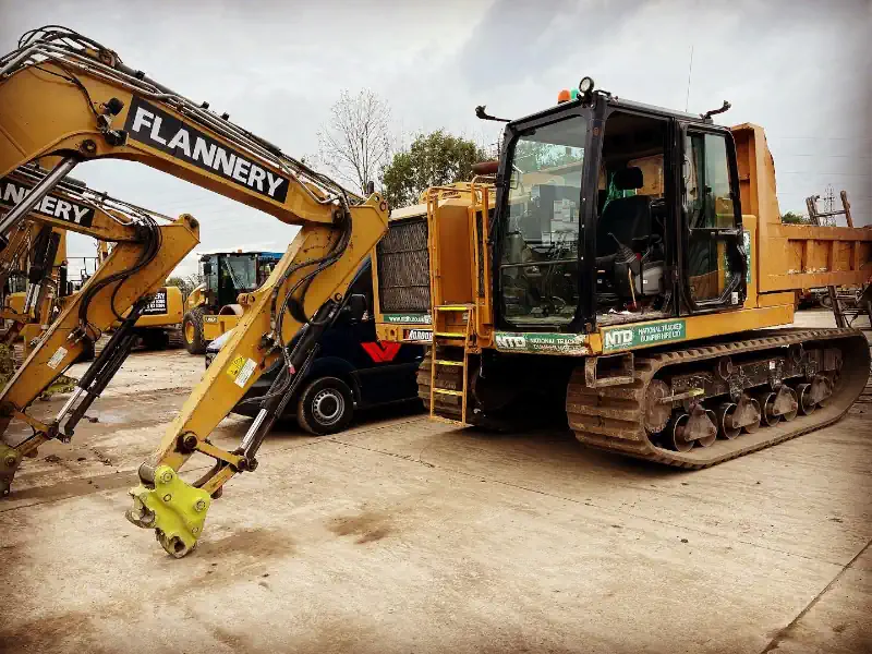 Quarry and Construction Machinery. Digger and Dumper Truck on Site.