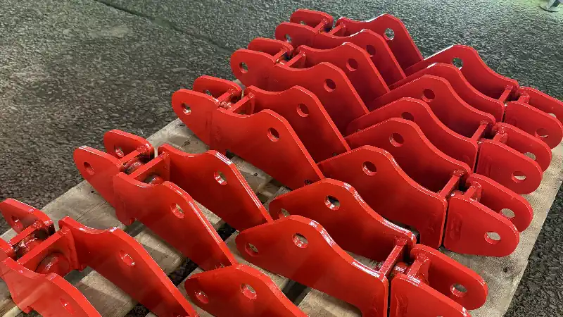 Reverse Engineering of Obsolete Parts. Row of Replacement parts Painted and ready for shipping on pallet.